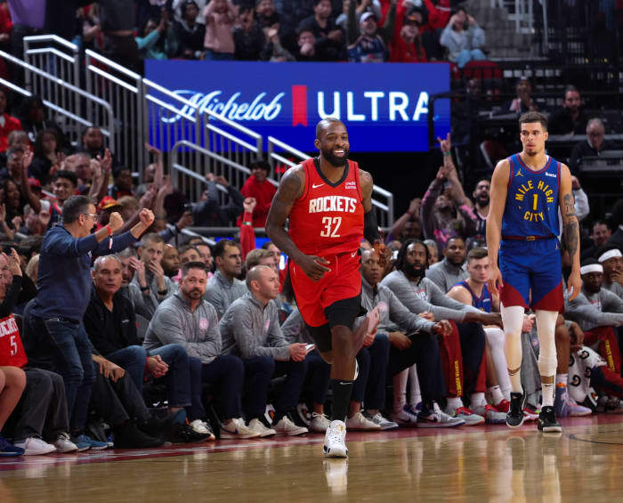 Rockets forward Jeff Green (32) reacts to his three-point basket against Denver Nuggets forward Michael Porter Jr. (1) in the second half at Toyota Center.